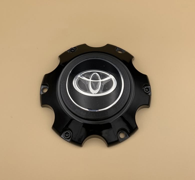 The assembled centre cap, with the Toyota emblem held in the printed adapter