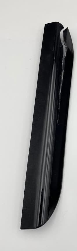 The original freezer door handle, cracked along its length and previously glued