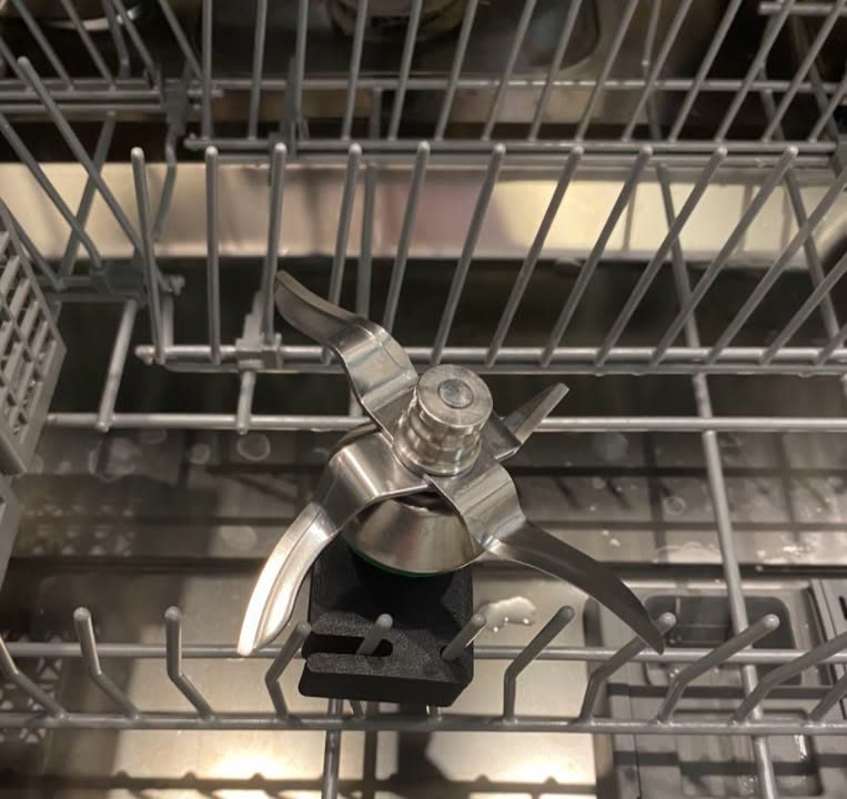 Thermomix blade held upright by the 3D printed dishwasher insert in the dishwasher rack