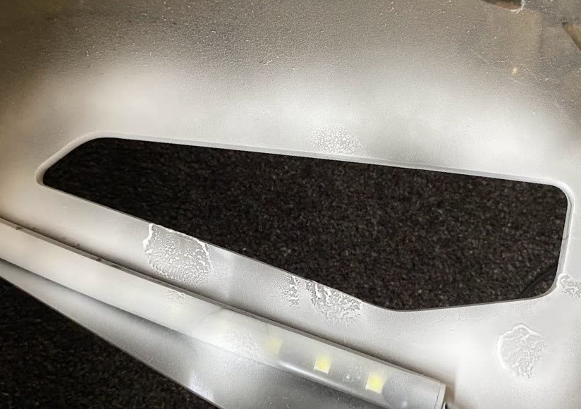 The removed factory windscreen panel, showing the opening the insert had to be made for